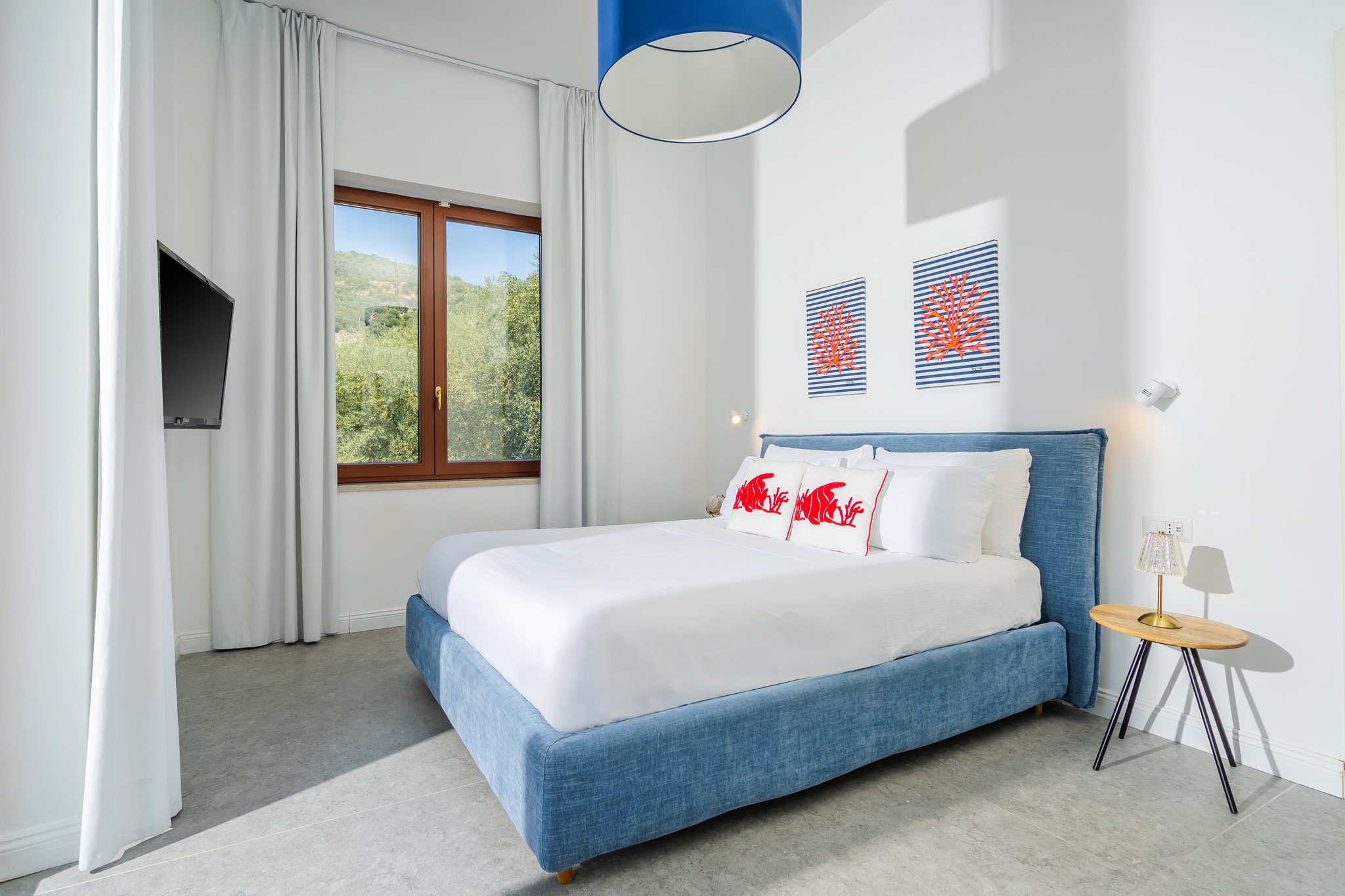 Bedroom with white interiors and coral details